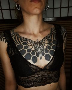 Chest piece tattoos by Manuel Zellkern