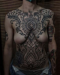 Chest piece tattoos by Manuel Zellkern