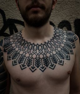 Chest piece tattoos by Manuel Zellkern