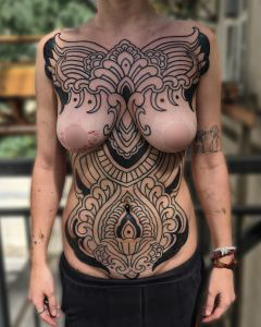 Chest piece tattoos by Manuel Zellkern